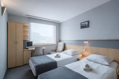 Łóżko lub łóżka w pokoju w obiekcie Weiser Hotel