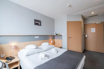 Łóżko lub łóżka w pokoju w obiekcie Weiser Hotel