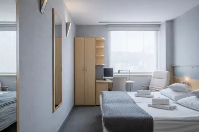 Łóżko lub łóżka w pokoju w obiekcie Weiser Hotel