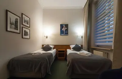 Łóżko lub łóżka w pokoju w obiekcie Polonia Raciborz