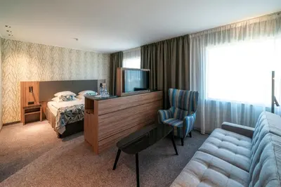 Łóżko lub łóżka w pokoju w obiekcie HP Park Plaza