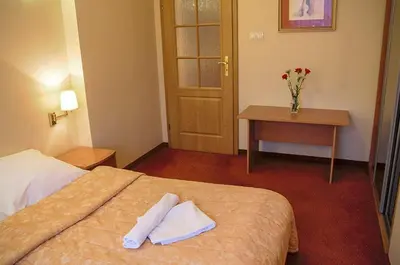 Łóżko lub łóżka w pokoju w obiekcie Pensjonat Beata
