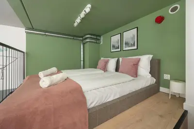 Łóżko lub łóżka w pokoju w obiekcie Airport Studio Zarembowicza by Noclegi Renters