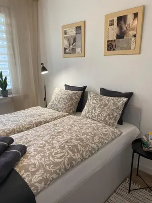 Łóżko lub łóżka w pokoju w obiekcie Nowoczesny Apartament w Dzierżoniowie - parter - balkon - pokój + sypialnia