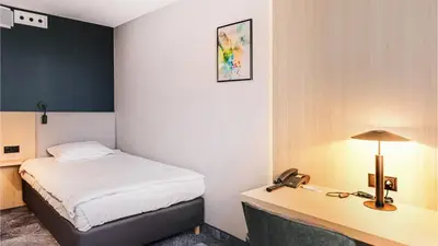 Łóżko lub łóżka w pokoju w obiekcie Qubus Hotel Legnica