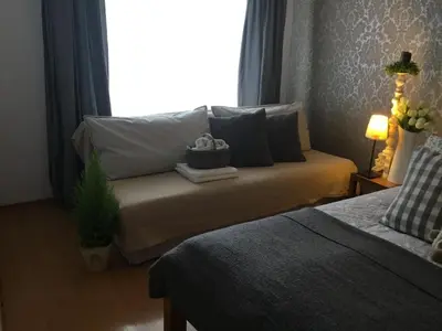 Łóżko lub łóżka w pokoju w obiekcie Polonia