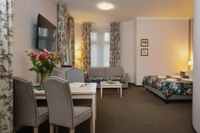 Łóżko lub łóżka w pokoju w obiekcie Hotel Amalia