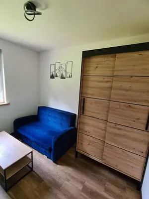 Łóżko lub łóżka w pokoju w obiekcie Noclegi przy Wiadukcie - Apartamenty