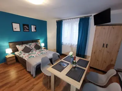 Łóżko lub łóżka w pokoju w obiekcie Noclegi przy Wiadukcie - Apartamenty