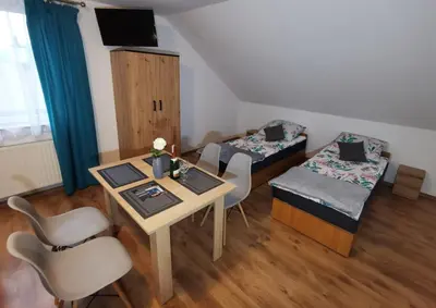 Łóżko lub łóżka w pokoju w obiekcie Noclegi przy Wiadukcie - Apartamenty