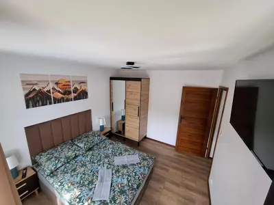 Łóżko lub łóżka w pokoju w obiekcie Noclegi przy Wiadukcie - Apartamenty