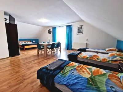 Łóżko lub łóżka w pokoju w obiekcie Noclegi przy Wiadukcie - Apartamenty