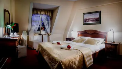 Łóżko lub łóżka w pokoju w obiekcie Hotel im. Jana Pawła II