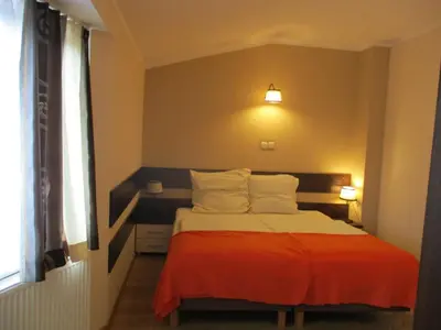 Łóżko lub łóżka w pokoju w obiekcie Hotel Pod Platanami