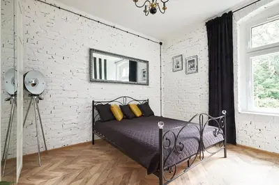 Łóżko lub łóżka w pokoju w obiekcie Art Apartment Grzmiąca