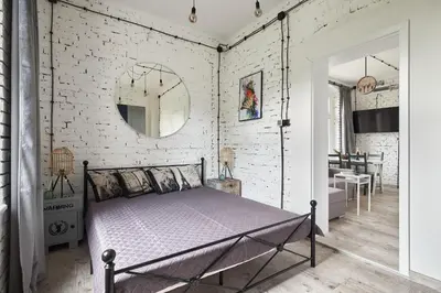 Łóżko lub łóżka w pokoju w obiekcie Loft Apartment Grzmiąca
