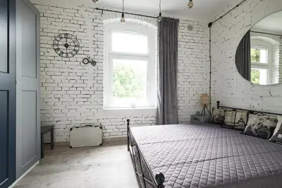 Łóżko lub łóżka w pokoju w obiekcie Loft Apartment Grzmiąca