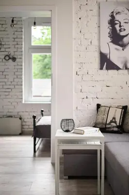 Łóżko lub łóżka w pokoju w obiekcie Loft Apartment Grzmiąca