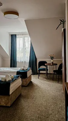 Łóżko lub łóżka w pokoju w obiekcie Pensjonat Miedziana Perła LUBIN