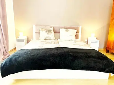Łóżko lub łóżka w pokoju w obiekcie GOŁĘBI PUCH - Przytulny Apartament na wyłączność Kudowa Zdrój