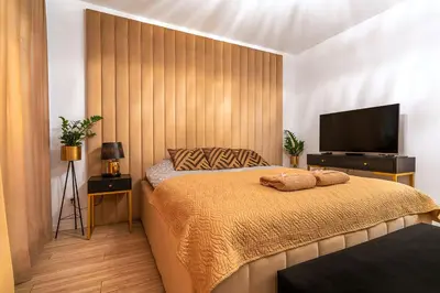 Łóżko lub łóżka w pokoju w obiekcie Apartament Versace Księcia Witolda