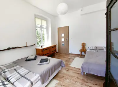 Łóżko lub łóżka w pokoju w obiekcie Apartament Alpejski Duży