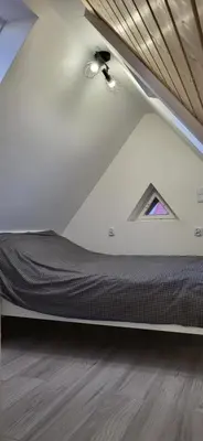 Łóżko lub łóżka w pokoju w obiekcie Apartament DWA DĘBY