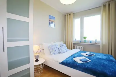 Łóżko lub łóżka w pokoju w obiekcie Apartament Stara Latarnia