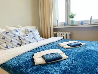 Łóżko lub łóżka w pokoju w obiekcie Apartament Stara Latarnia