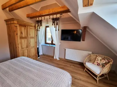 Łóżko lub łóżka w pokoju w obiekcie Willa Eber Wawrzyszów z dala od miasta