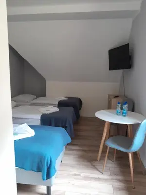 Łóżko lub łóżka w pokoju w obiekcie Willa Góralka