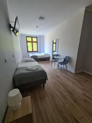 Łóżko lub łóżka w pokoju w obiekcie Willa Góralka