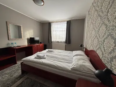 Łóżko lub łóżka w pokoju w obiekcie Hotel Ava