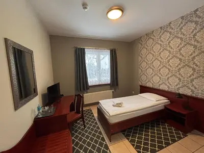 Łóżko lub łóżka w pokoju w obiekcie Hotel Ava