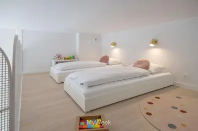 Łóżko lub łóżka w pokoju w obiekcie Ogrody Pieniawskie, MyWeek