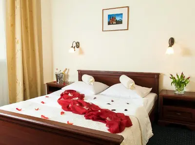 Łóżko lub łóżka w pokoju w obiekcie Hotel Arkadia