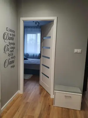 Łóżko lub łóżka w pokoju w obiekcie Apartament na Letniej z garażem 