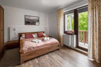 Łóżko lub łóżka w pokoju w obiekcie Apartament CALLUNA