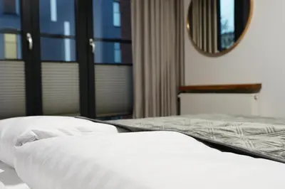 Łóżko lub łóżka w pokoju w obiekcie HALO Apartament 07