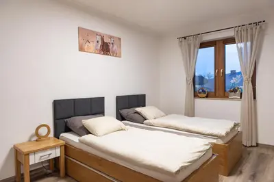 Łóżko lub łóżka w pokoju w obiekcie Apartament Nad Stajnią