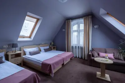 Łóżko lub łóżka w pokoju w obiekcie Villa Elise Park Pension