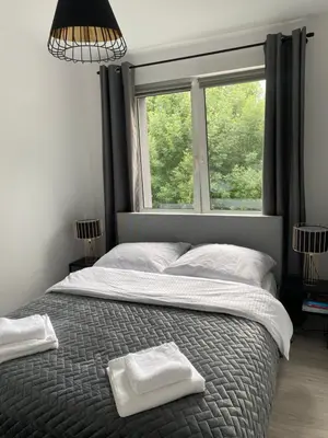 Łóżko lub łóżka w pokoju w obiekcie Apartament Malczewskiego