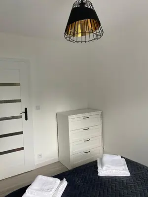 Łóżko lub łóżka w pokoju w obiekcie Apartament Malczewskiego