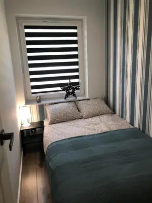 Łóżko lub łóżka w pokoju w obiekcie Apartament Główna 21