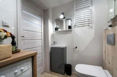 Łazienka w obiekcie OW Mewa domki apartamenty nad jeziorem