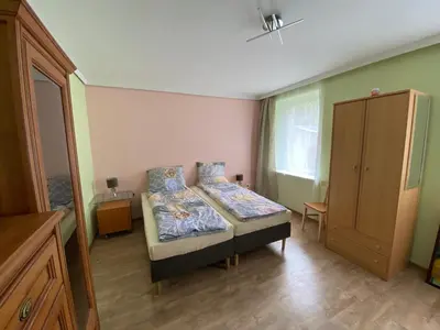 Łóżko lub łóżka w pokoju w obiekcie Ratuszowa Noclegi