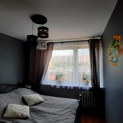 Łóżko lub łóżka w pokoju w obiekcie Apartament Grodzka