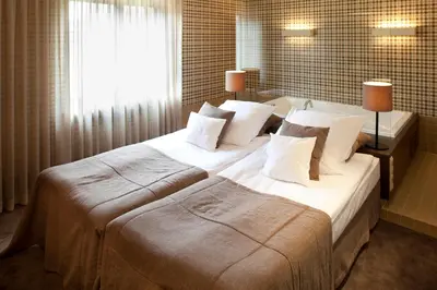 Łóżko lub łóżka w pokoju w obiekcie Hotel Wawrzyniak
