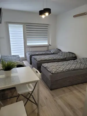 Łóżko lub łóżka w pokoju w obiekcie Paloma9