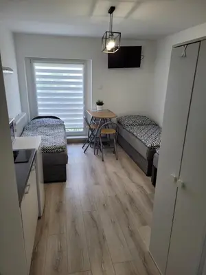 Łóżko lub łóżka w pokoju w obiekcie Paloma11